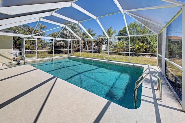 pool featuring a lanai and a patio area