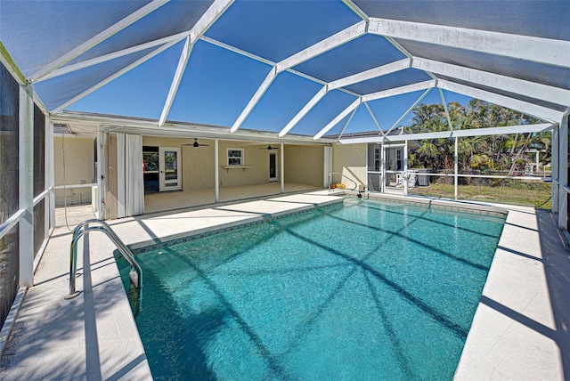 pool with a patio, a ceiling fan, and a lanai