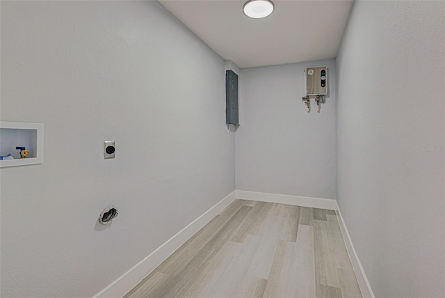 laundry room with baseboards, laundry area, electric dryer hookup, washer hookup, and light wood-style floors