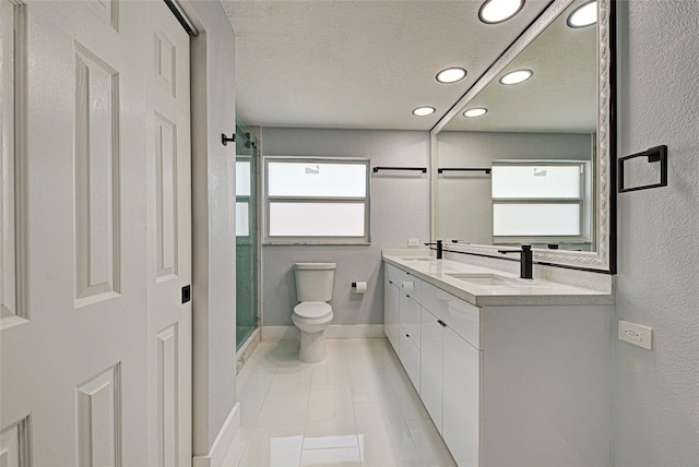 full bath featuring toilet, a stall shower, a sink, a textured ceiling, and double vanity