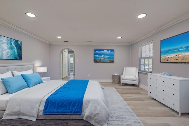 bedroom with baseboards, light wood finished floors, recessed lighting, arched walkways, and ornamental molding