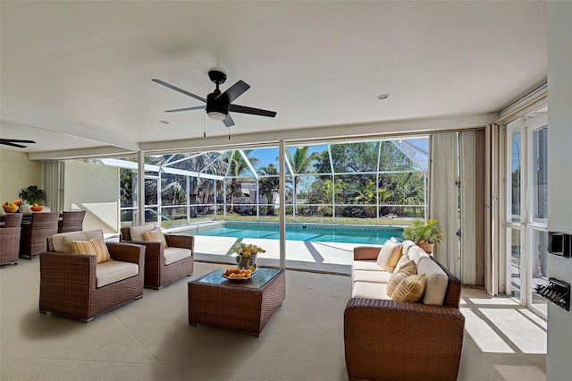 exterior space with a lanai, an outdoor living space, a patio, and ceiling fan