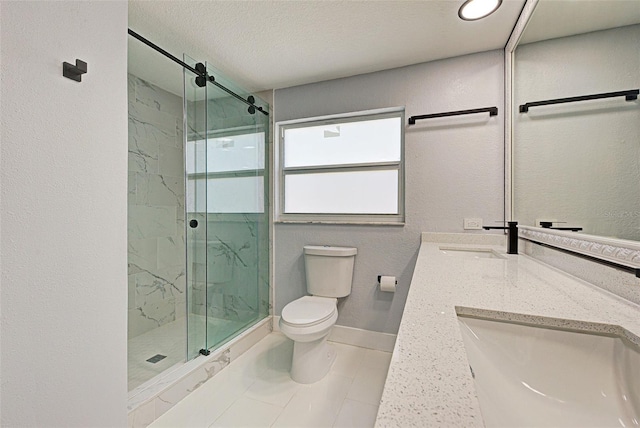 full bathroom with vanity, baseboards, a marble finish shower, a textured ceiling, and toilet