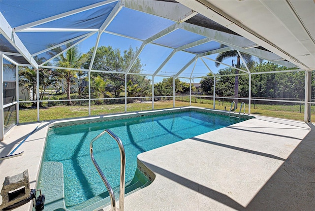 outdoor pool featuring a patio, a yard, and a lanai