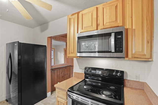 kitchen featuring light brown cabinets, black appliances, ceiling fan, and light countertops