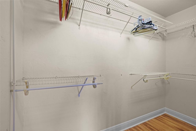 spacious closet with light wood-style flooring