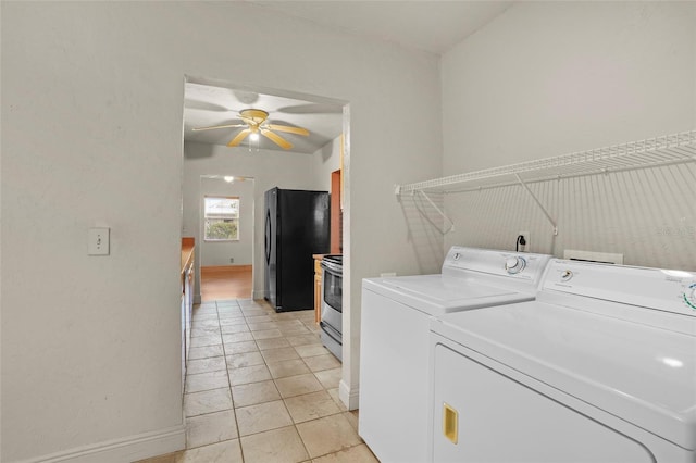 washroom featuring ceiling fan, light tile patterned floors, washing machine and dryer, laundry area, and baseboards