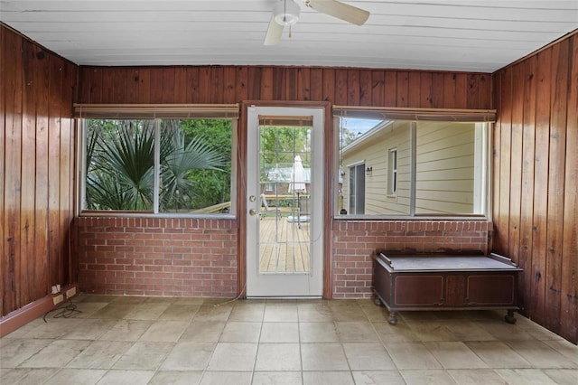 interior space with ceiling fan