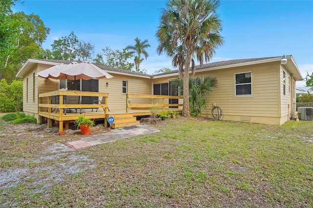 back of house with a deck, crawl space, a lawn, and cooling unit