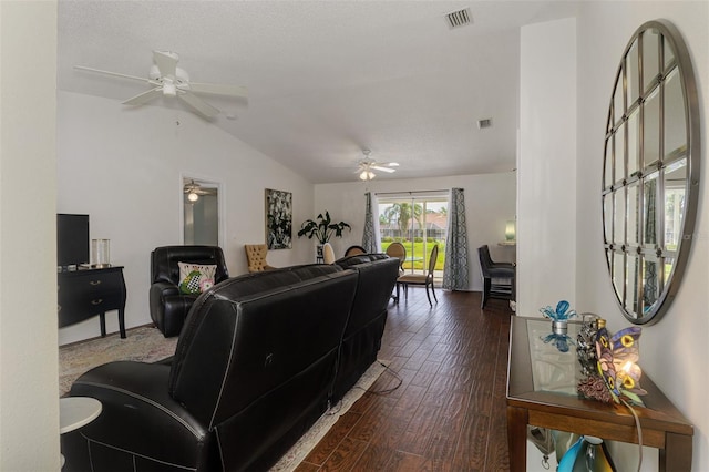 living area with dark wood-style floors, ceiling fan, lofted ceiling, and visible vents