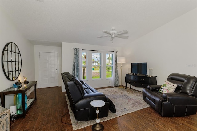 living area with ceiling fan, baseboards, and wood finished floors