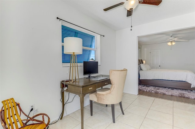 bedroom with light tile patterned floors and ceiling fan