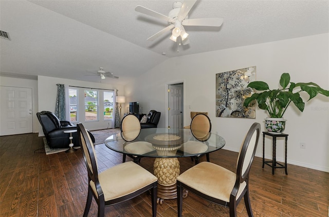 dining room featuring ceiling fan, vaulted ceiling, baseboards, and wood finished floors