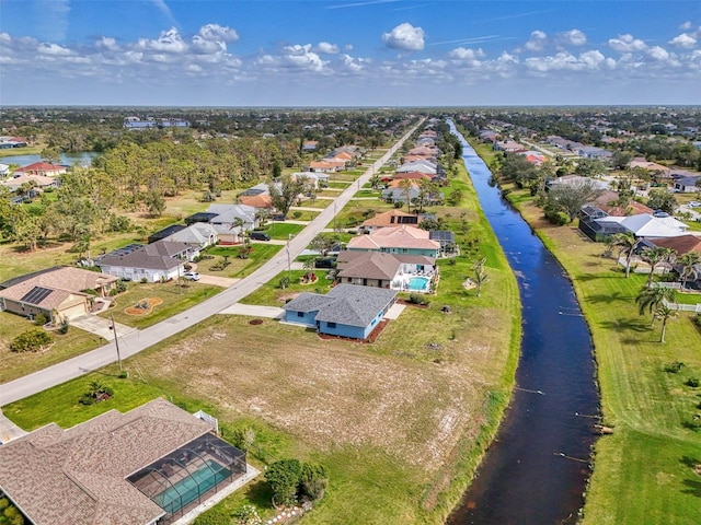 aerial view with a residential view and a water view