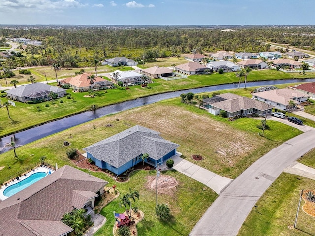 bird's eye view featuring a water view and a residential view