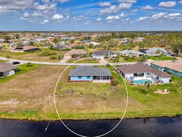 aerial view with a water view and a residential view