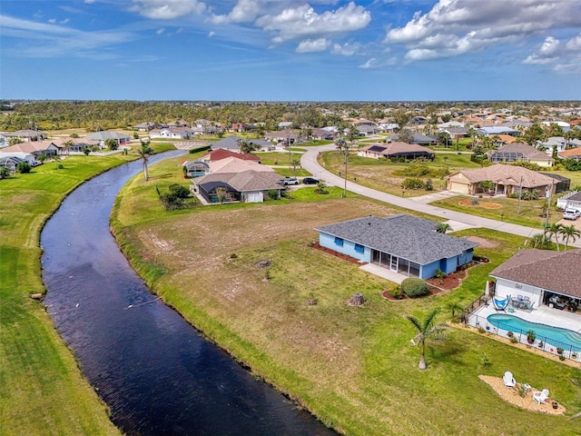 aerial view featuring a water view and a residential view