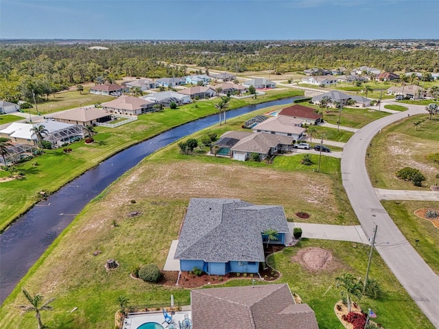 bird's eye view with a residential view and a water view