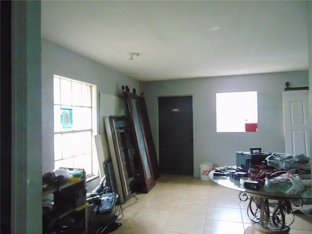 interior space with light tile patterned floors