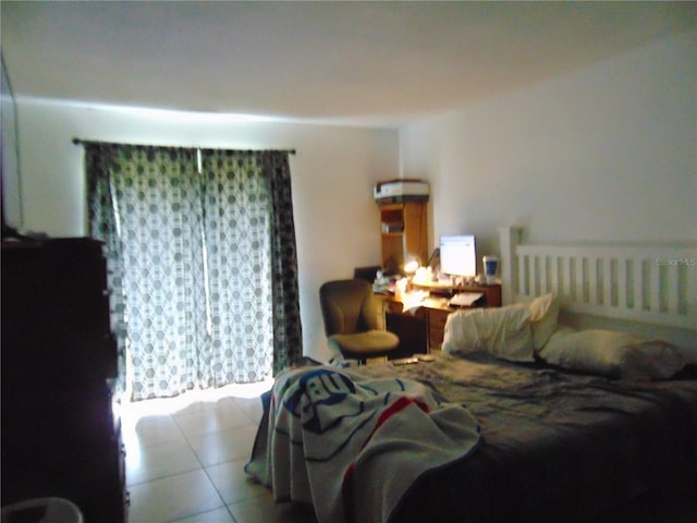 tiled bedroom featuring radiator heating unit