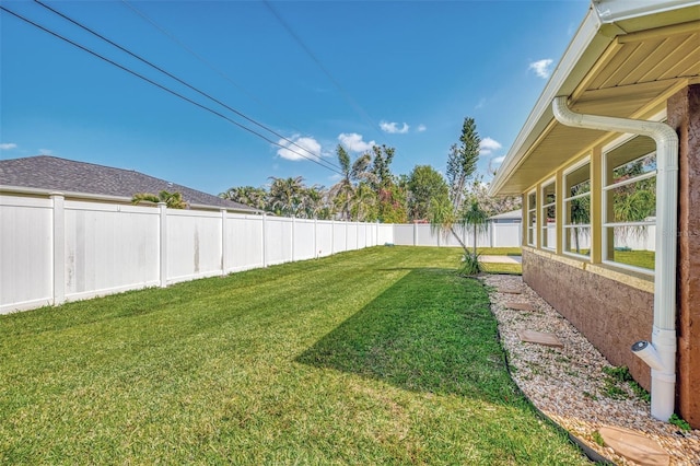 view of yard with a fenced backyard