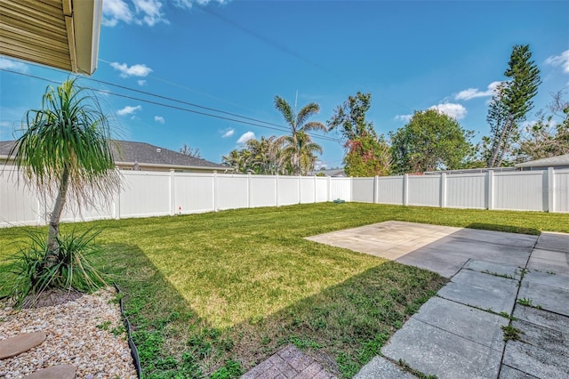 view of yard featuring a patio area and a fenced backyard