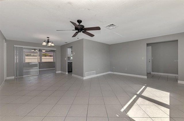 spare room featuring visible vents, baseboards, and light tile patterned floors