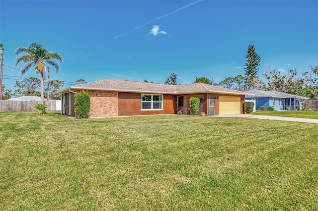 ranch-style house with brick siding, fence, a garage, driveway, and a front lawn