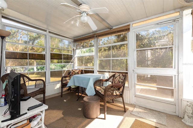 sunroom / solarium featuring a wealth of natural light and a ceiling fan