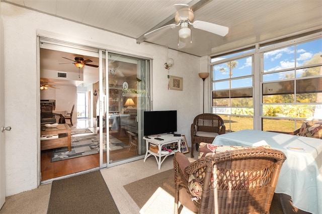 sunroom / solarium with visible vents and ceiling fan