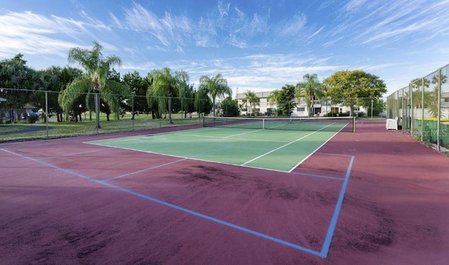 view of sport court with fence