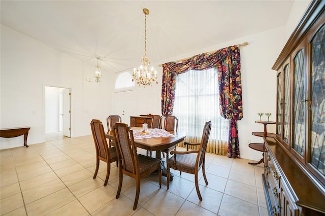 dining space featuring an inviting chandelier and light tile patterned flooring