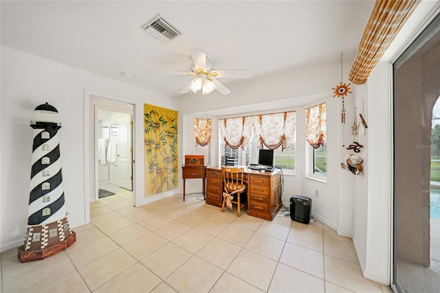 office area featuring visible vents, ceiling fan, baseboards, and light tile patterned flooring