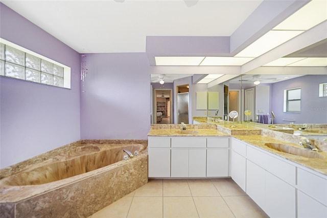 full bath with a stall shower, ceiling fan, tile patterned flooring, and a sink