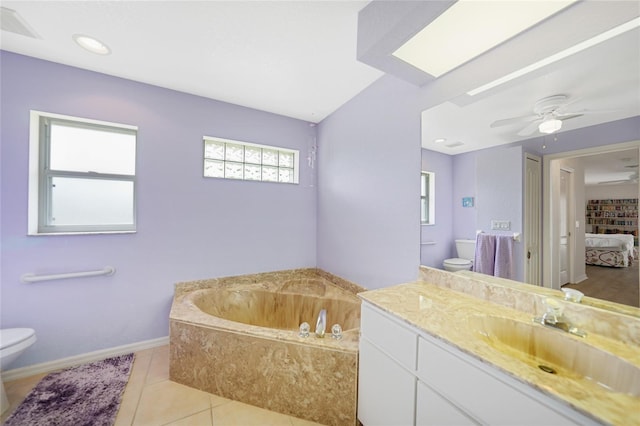 ensuite bathroom featuring a garden tub, toilet, connected bathroom, vanity, and tile patterned floors