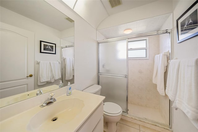 bathroom featuring toilet, a shower stall, visible vents, and vanity