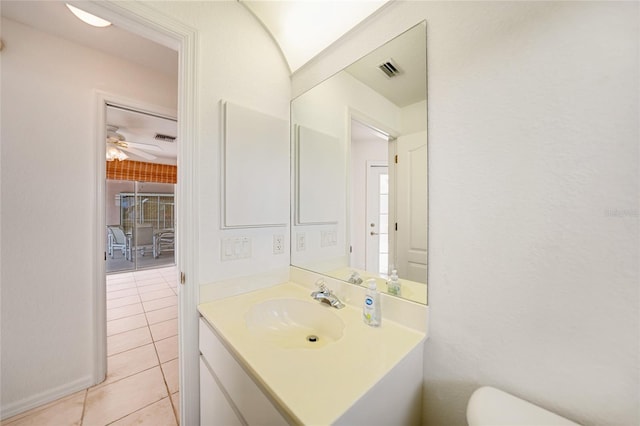 bathroom with tile patterned flooring, visible vents, vanity, and toilet