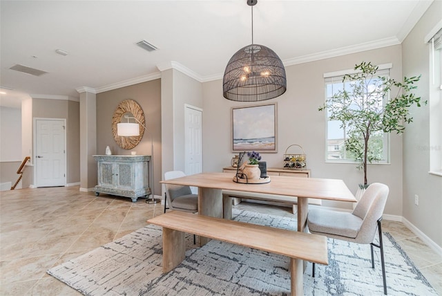 dining area featuring light tile patterned floors, visible vents, baseboards, and crown molding