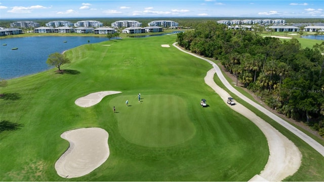 aerial view with view of golf course and a water view