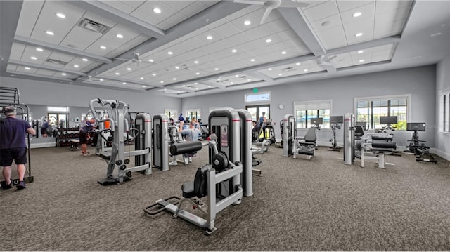 exercise room with recessed lighting, visible vents, baseboards, and a towering ceiling