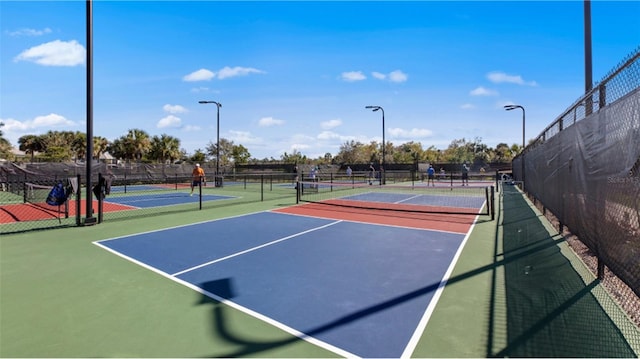 view of sport court with community basketball court and fence