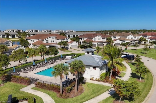 birds eye view of property with a residential view