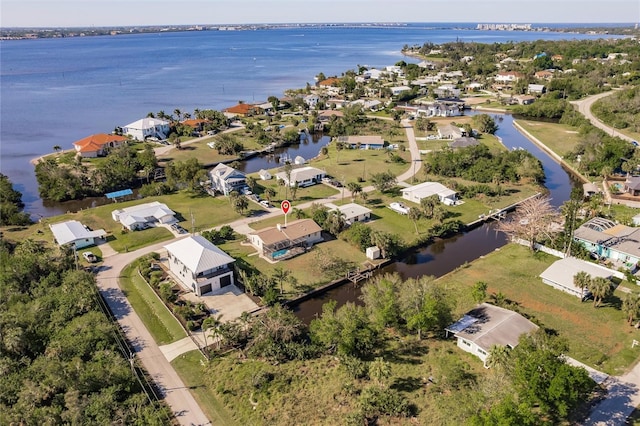 birds eye view of property with a residential view and a water view