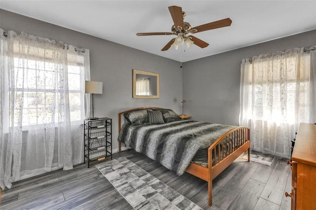 bedroom with ceiling fan and wood finished floors