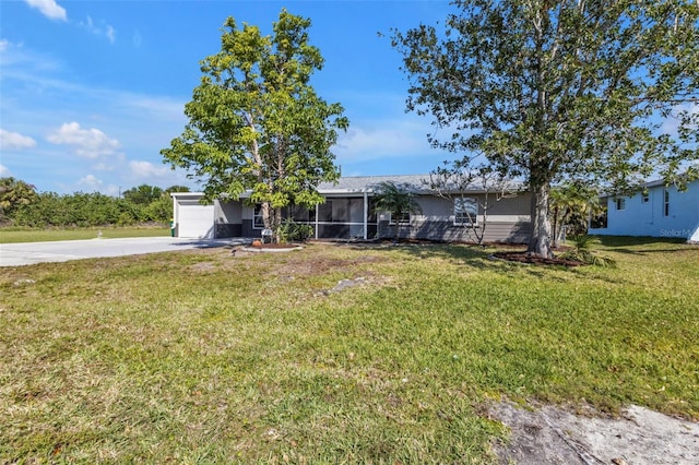 view of front of property with an attached garage, a front yard, and concrete driveway