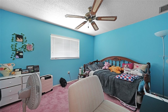 bedroom with carpet floors, visible vents, ceiling fan, a textured ceiling, and baseboards