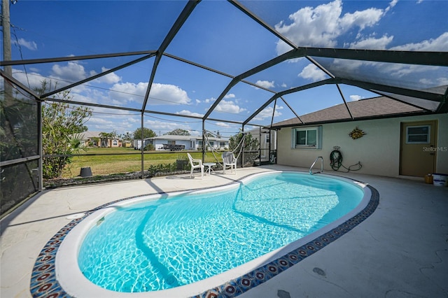 outdoor pool with a lanai, a yard, and a patio