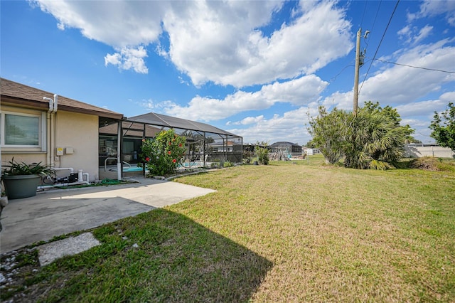 view of yard with a patio area and a lanai