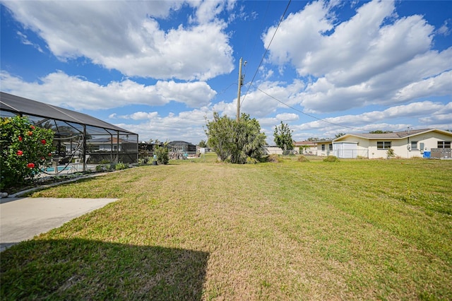 view of yard with glass enclosure