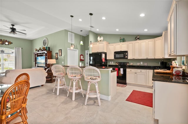 kitchen featuring recessed lighting, black appliances, vaulted ceiling, dark countertops, and a center island